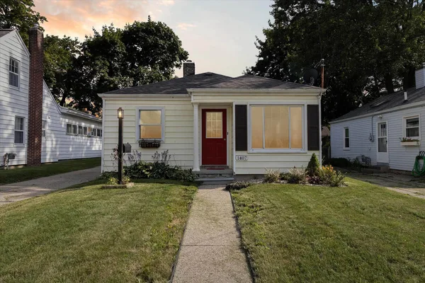 A brick home with a covered porch